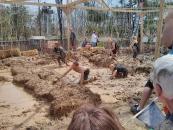 with his shoes in his hands